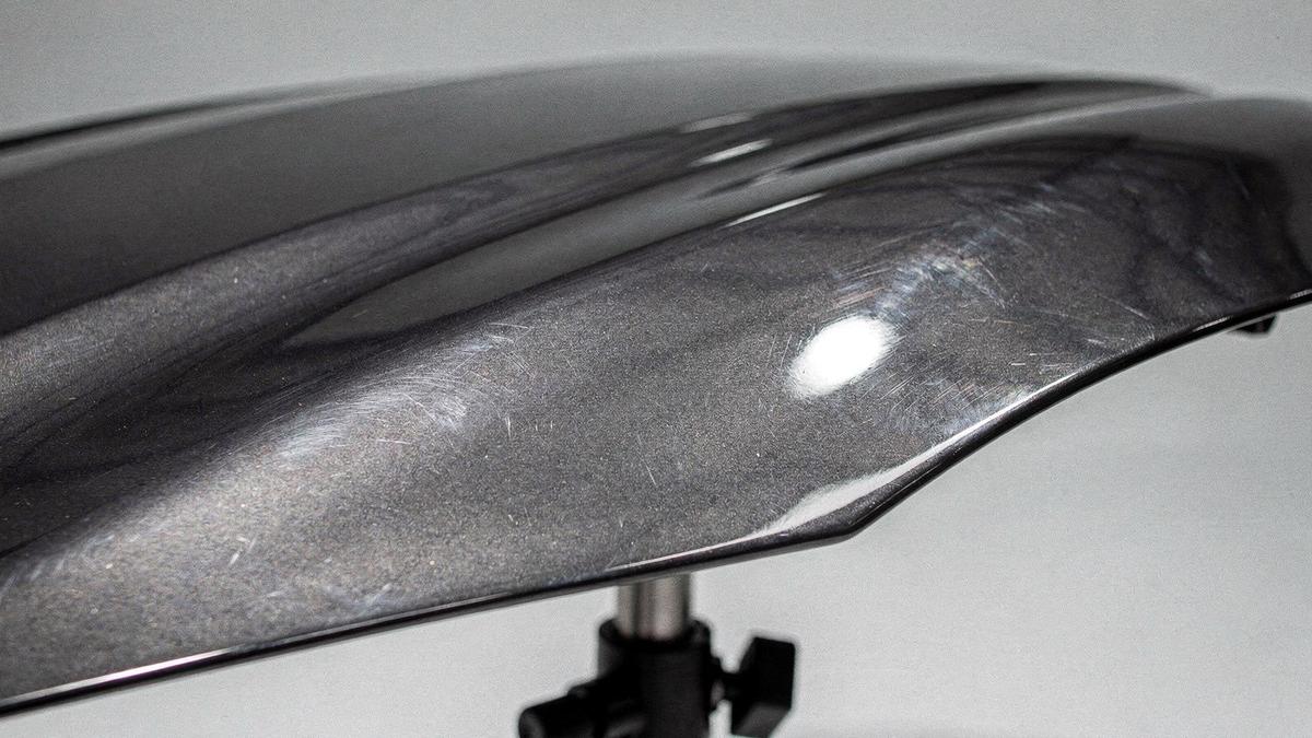 Car hood panel with dull, swirled paint before correction